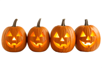 Four spooky jack o lanterns glowing with light isolated on transparent background