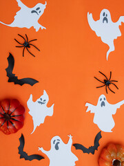 A frame in the form of a scattered ghost, spiders, a box with an orange ribbon for Halloween.