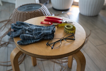 Necessary tools for weaving a rattan basket, top view, gloves, centimeter, knife, and nippers. Decoration