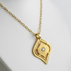 Elegant gold necklace with pendant isolated on white background