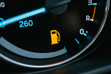 Naklejka premium Yellow fuel gauge icon on car meter dashboard display.