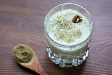 close-up smoothie matcha in glass crystal glass