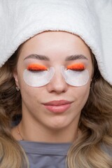 Caucasian woman undergoing eyelash lamination procedure. top view. 