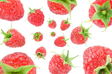 Fresh raspberries swirling in air against white background