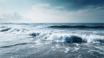 Fototapeta premium Foamy waves crash on a tranquil shoreline.