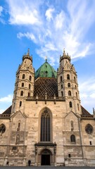Fototapeta premium Medieval cathedral facade against a vivid blue sky