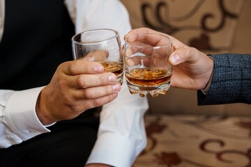 Two Well-Dressed Men Toasting Whiskey Glasses in an Elegant Room, Business Celebration and Luxury...