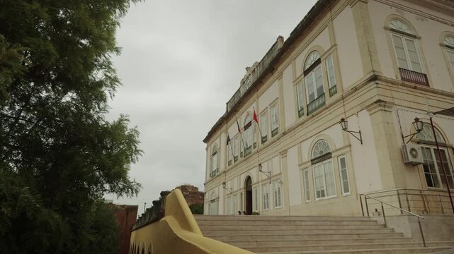Historic municipal building with flags in Silves, Algarve, Portugal