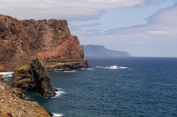 Madeira island Portugal close up hills cliff rocks blue water Atlantic Ocean shore seascape rough mountains scenery vacation hiking trail sightseeing valley journey idyllic