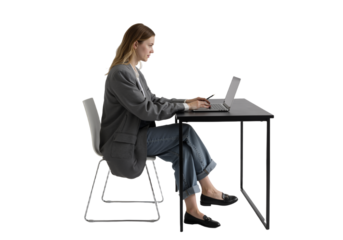Woman working at a desk on a laptop, side view, focused on her work during the day with concept