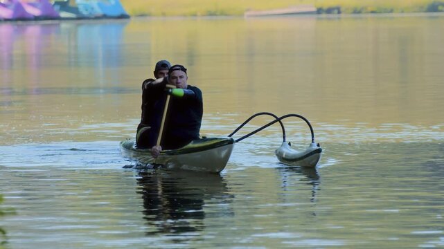 Two Men Kayaking Together on the Water
