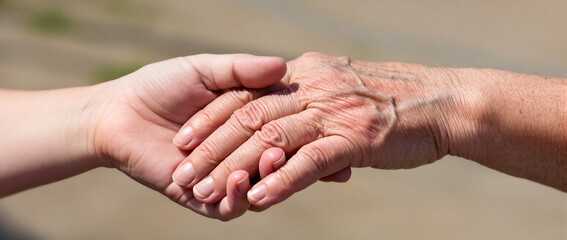 two hands holding each other