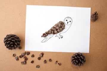Pine cone owl craft for children creative project, suitable for children books, hobby blogs, learning apps, fall-themed branding, early education kits, and eco-toy advertising,
