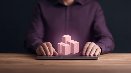 A person interacts with digital blocks hovering above a laptop, symbolizing innovation and technology in a modern workspace.