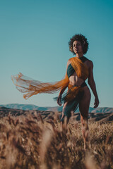 Woman standing in a dramatic landscape