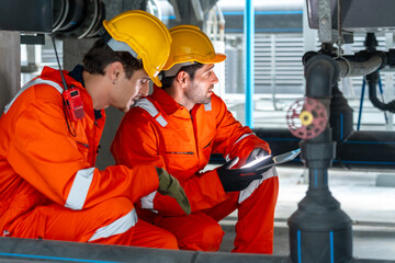 Industrial engineer teamwork maintenance pipeline valves air HVAC cooling systems at construction...