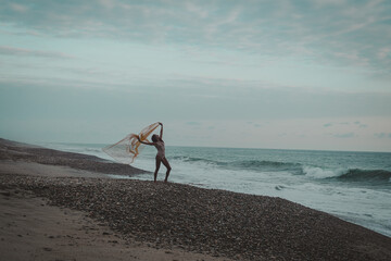 young woman walking on the beach