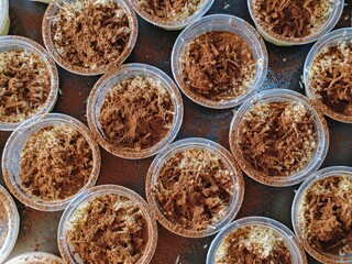 Tiramisu Dessert Cups Overhead View of CocoaDusted Treats in Plastic Containers.
