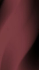 Abstract burgundy background with subtle shading and speckles.