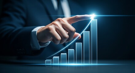 Business growth and success concept. An executive's hand touches the tip of a rising holographic bar chart, with the last bar glowing brightest.