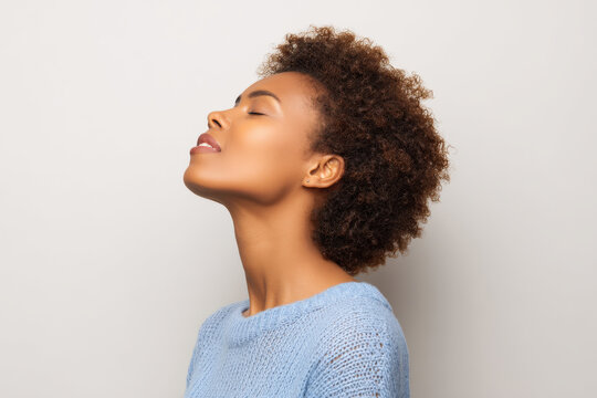 woman gasps for air in despair tears streaming down her face against clean solid background