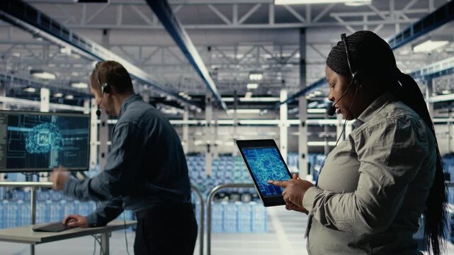 Team of data center programmers use AI to help customers resolve website hosting problems. Teamworking server farm tech support experts help users keep their online services running smoothly, camera A