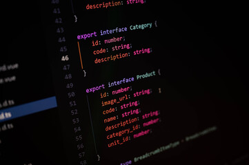 Close-up of TypeScript code defining interfaces for product and category data structures, representing modern frontend development, object typing, and clean code architecture.