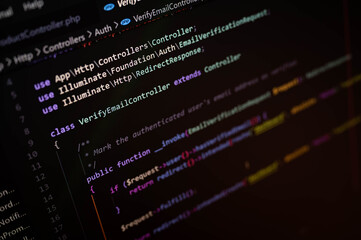 Close-up of computer screen displaying PHP code for a web development project using Laravel framework, highlighting software engineering and back-end programming in modern tech.