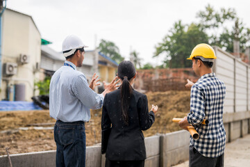 Fototapeta premium Engineers and architect discussing a new housing project