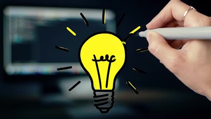 Hand Drawing Yellow Light Bulb Idea on Dark Background with Computer Screen Innovation Concept and Creative Solution