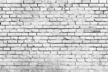 Obraz premium A close-up view of a weathered white brick wall. Mortar lines are visible, and some bricks show signs of age and wear