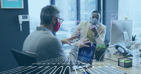 Two masked coworkers in business attire discussing data in urban office, with neon graph divider