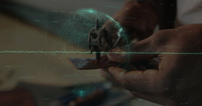 Displaying technician hands holding rotor assembly above workshop bench, with holographic overlay