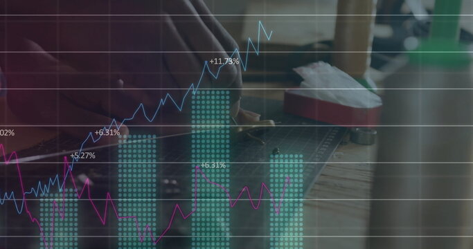 Placing knife on green mat, maker at studio bench, financial overlay, copy space - Powered by Adobe