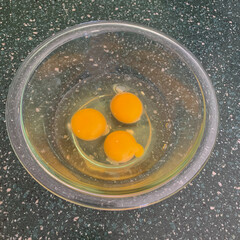 Top view of bowl with three eggs