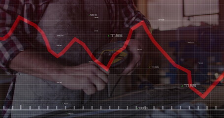 Measuring mature craftsman using digital caliper on wooden plank in woodshop, with red data overlay