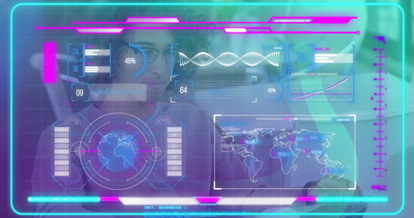 Man wearing glasses and T-shirt examining holographic data overlay in office, with DNA helix