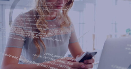 Office woman in mesh top reviewing code on smartphone at desk with laptop, copy space