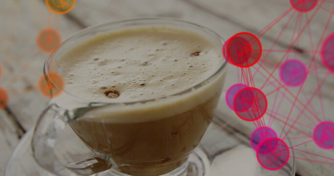 Fototapeta Displaying clear glass coffee cup resting on wooden tabletop, with network graphic nodes