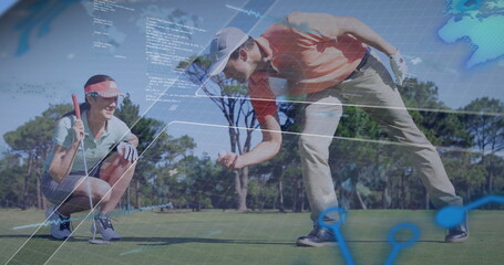 Kneeling and crouching couple in golf attire examining putt line on golf green, digital overlays