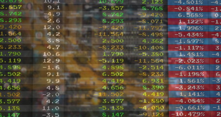 Displaying translucent digital financial panel showing colored figures in trading floor, data table