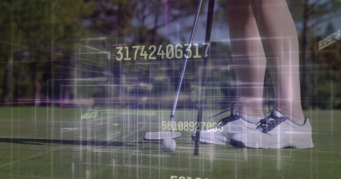 Golfer's legs in golf shoes aligning putter behind ball on putting green, with digital data overlay