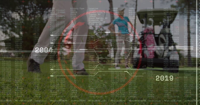 Swinging female golfer wearing trousers and golf shoes on fairway, with red reticle and code charts