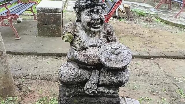 A statue that resembles a representation of Batara Guru, also known as Shiva in Balinese Hindu beliefs, or perhaps also a Dwarapala statue that functions as a door or gate guard.