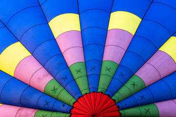 inside hot air balloon's envelope colorful nylon fabric holding heated air