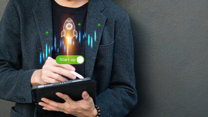 Businessman launching startup with rocket icon and digital interface