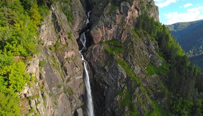 Mountain waterfall cascading down rocky face