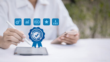 Hand Using Tablet With Virtual Quality Assurance Certification Badge