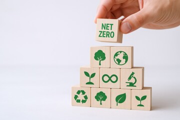 Net Zero Concept with Hand Placing Block on Stack of Environmental Icons, Sustainable Future