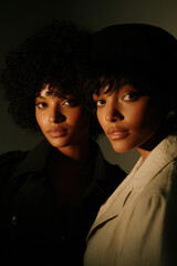 captivating portrait of two models who perfectly match in style and pose creating striking visual contrast